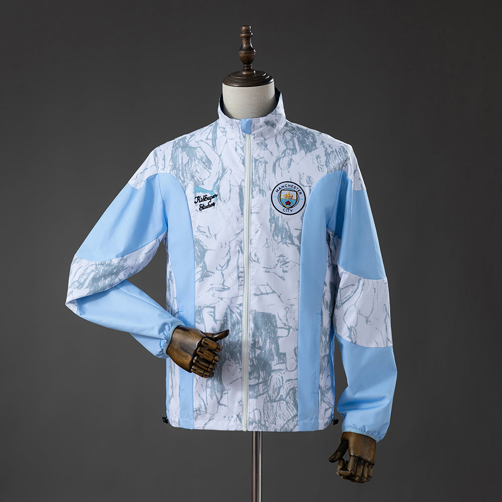 Jaqueta Corta Vento Puma Manchester City x Kidsuper 2026 Reversível Dupla Face
